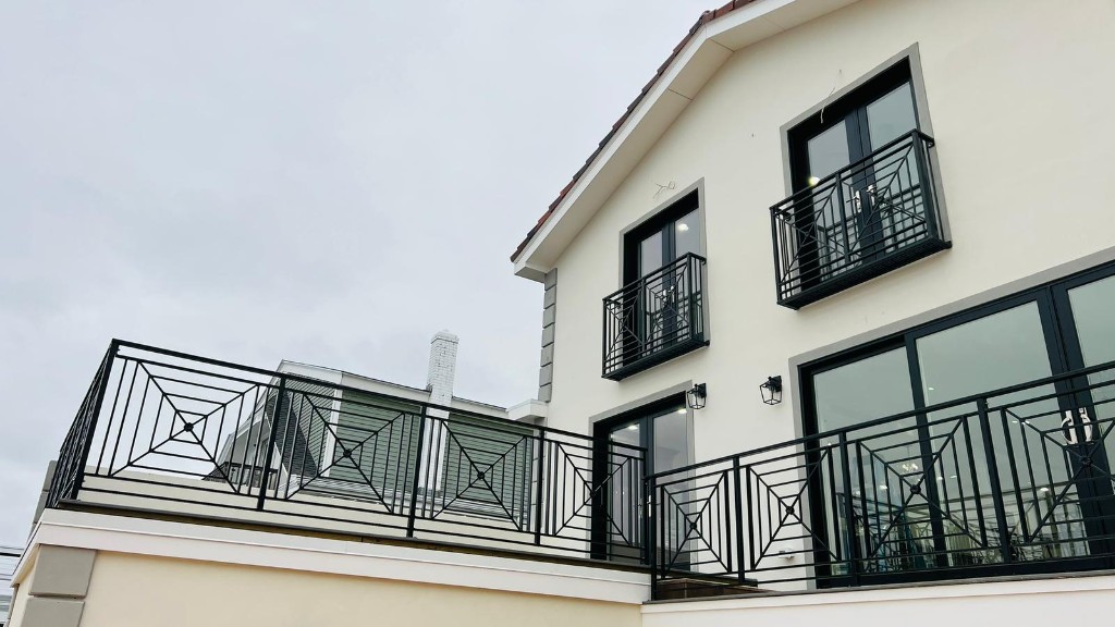 Geometric black metal balcony and terrace railings on a custom home