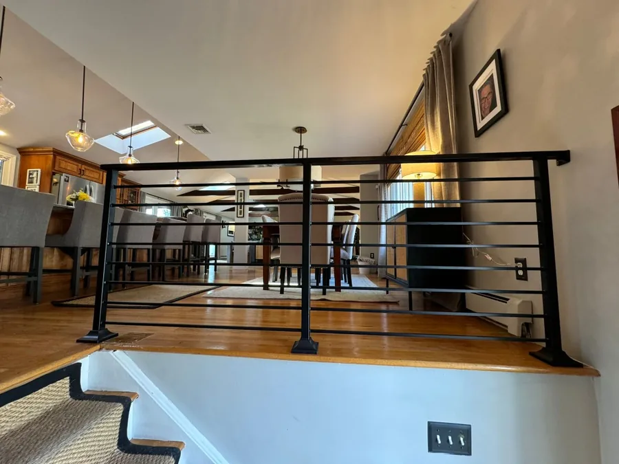 Modern interior black metal railing by a staircase